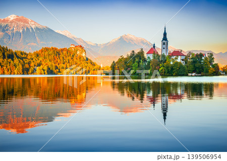 Bled, Slovenia. Sunrise water reflection on iconic Lake Bled Bled, Slovenia. Sunrise water reflection on iconic Lake Bled 139506954