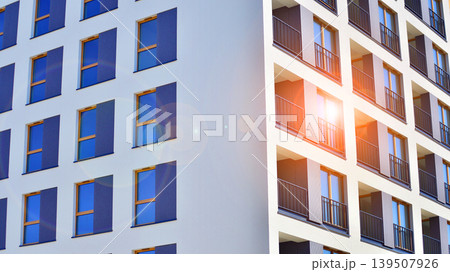 Downtown modern residential architecture. Architectural details of modern apartment building. Modern european residential apartment building complex. Downtown modern residential architecture. Architectural details of modern apartment building. Modern european residential apartment building complex. 139507926