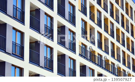 Downtown modern residential architecture. Architectural details of modern apartment building. Modern european residential apartment building complex. Downtown modern residential architecture. Architectural details of modern apartment building. Modern european residential apartment building complex. 139507927