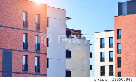 Downtown modern residential architecture. Architectural details of modern apartment building. Modern european residential apartment building complex. Downtown modern residential architecture. Architectural details of modern apartment building. Modern european residential apartment building complex. 139507943