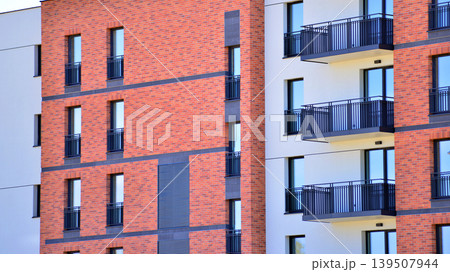 Downtown modern residential architecture. Architectural details of modern apartment building. Modern european residential apartment building complex. Downtown modern residential architecture. Architectural details of modern apartment building. Modern european residential apartment building complex. 139507944