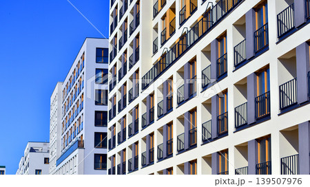 Downtown modern residential architecture. Architectural details of modern apartment building. Modern european residential apartment building complex. Downtown modern residential architecture. Architectural details of modern apartment building. Modern european residential apartment building complex. 139507976