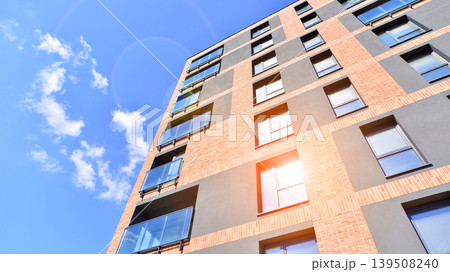 Downtown modern residential architecture. Architectural details of modern apartment building. Modern european residential apartment building complex. Downtown modern residential architecture. Architectural details of modern apartment building. Modern european residential apartment building complex. 139508240