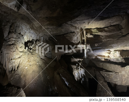 Geologic cave showcasing natural stalactite and stalagmite structures Geologic cave showcasing natural stalactite and stalagmite structures 139508540