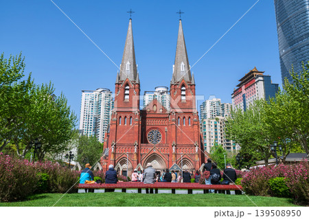 Christian people at garden view St. Ignatius Xujiahui Cathedral, Shianghai Christian people at garden view St. Ignatius Xujiahui Cathedral, Shianghai 139508950