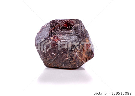 Macro of a mineral garnet stone on a white background 139511088