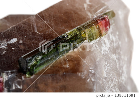 Macro mineral tourmaline stone in quartz on a white background 139511091
