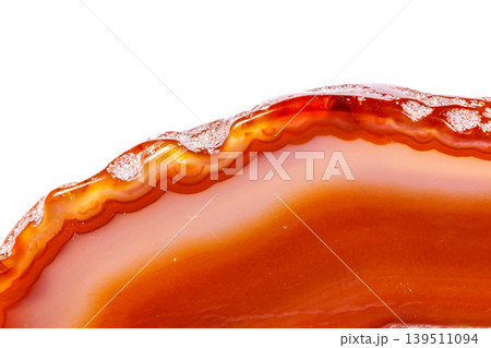 Macro mineral orange agate in crystals on white background Macro mineral orange agate in crystals on white background 139511094