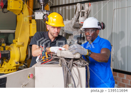 Diverse Engineering Team 20-40s Troubleshooting Robotic Systems 139511694