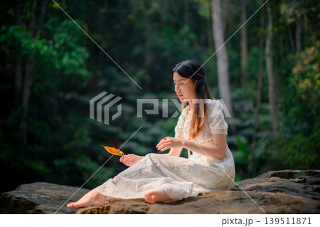 beautiful woman in white dress in deep forest, elf princess fairy tale concept 139511871