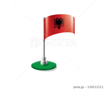 Albanian flag on a flagpole mounted on the grass Albanian flag on a flagpole mounted on the grass 139512511
