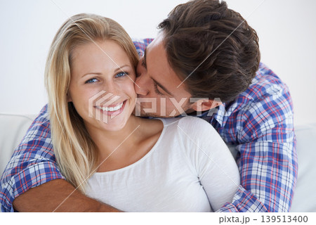 Happy couple, portrait and kissing with hug, marriage and embrace for love, home and couch. Wife, husband and smile for commitment, bonding together and care for relationship, man and woman Happy couple, portrait and kissing with hug, marriage and embrace for love, home and couch. Wife, husband and smile for commitment, bonding together and care for relationship, man and woman 139513400