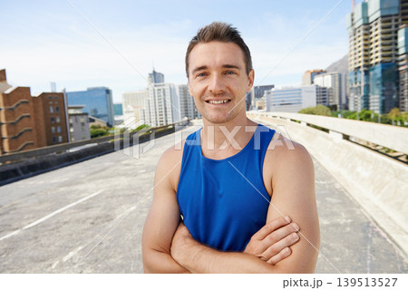 Happy man, arms crossed in city and fitness outdoor for workout, training and athlete smile in portrait for sports. Confidence, face and exercise on urban bridge, health and wellness in Chicago Happy man, arms crossed in city and fitness outdoor for workout, training and athlete smile in portrait for sports. Confidence, face and exercise on urban bridge, health and wellness in Chicago 139513527
