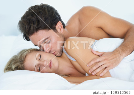 Man, kiss or woman sleeping in bed for fatigue, peace or dreaming to relax on holiday vacation. Couple, romantic love or tired wife on break enjoying nap, bedroom sleep or resting at night in home Man, kiss or woman sleeping in bed for fatigue, peace or dreaming to relax on holiday vacation. Couple, romantic love or tired wife on break enjoying nap, bedroom sleep or resting at night in home 139513563