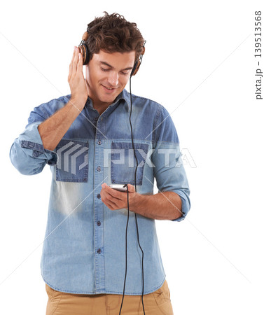 Technology, music and headphones with casual man in studio isolated on white background for streaming. Relax, smile or audio player with young guy listening to radio on sound device for entertainment Technology, music and headphones with casual man in studio isolated on white background for streaming. Relax, smile or audio player with young guy listening to radio on sound device for entertainment 139513568