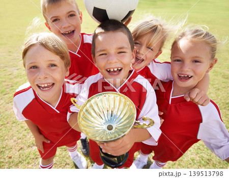 Children, soccer team and portrait with cup, boys and girls with victory, support or solidarity. Achievement, sports and friendship, together and happy for win, ready for game or physical activity Children, soccer team and portrait with cup, boys and girls with victory, support or solidarity. Achievement, sports and friendship, together and happy for win, ready for game or physical activity 139513798