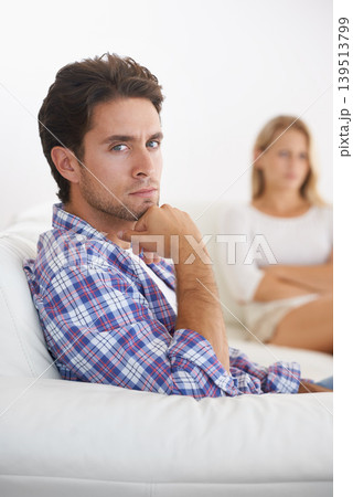 Man, angry and living room couch with disagreement, upset and thinking with anger, fight or mad. Divorce, betrayal and relationship with cheating, stress and argument for marriage, home and woman Man, angry and living room couch with disagreement, upset and thinking with anger, fight or mad. Divorce, betrayal and relationship with cheating, stress and argument for marriage, home and woman 139513799