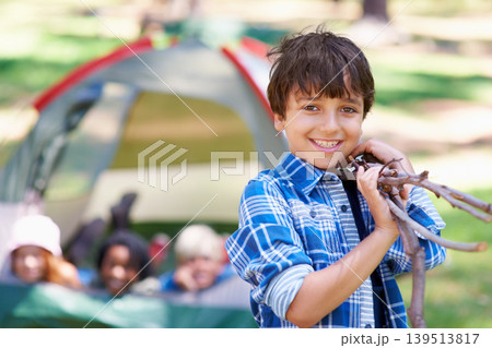 Wood, camping or portrait of boy in forest for playing, adventure or holiday vacation in park. Relax, collect or happy child with smile or sticks in woods, garden or nature for fun hiking or wellness Wood, camping or portrait of boy in forest for playing, adventure or holiday vacation in park. Relax, collect or happy child with smile or sticks in woods, garden or nature for fun hiking or wellness 139513817