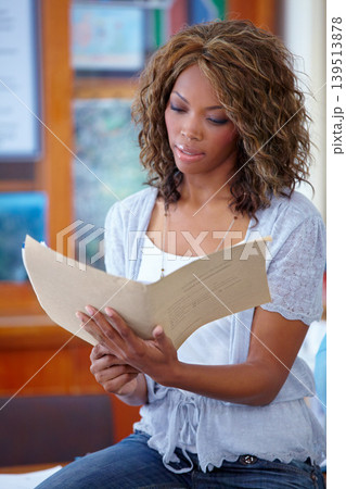 Black woman, teacher and reading documents in classroom for education or learning syllabus. African female person, lecturer or educator checking paperwork for studying, literature or story at class Black woman, teacher and reading documents in classroom for education or learning syllabus. African female person, lecturer or educator checking paperwork for studying, literature or story at class 139513878