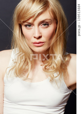 Woman, face and beauty with hair and shine, cosmetic care and salon treatment on dark background. Young model from Sweden in studio, healthy texture and haircare for growth with glow in portrait Woman, face and beauty with hair and shine, cosmetic care and salon treatment on dark background. Young model from Sweden in studio, healthy texture and haircare for growth with glow in portrait 139513884