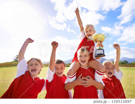 Celebration, soccer team and children with cup, boys and girls with victory, support or proud. Achievement, sports and friendship, together and happy for win, ready for game or physical activity Celebration, soccer team and children with cup, boys and girls with victory, support or proud. Achievement, sports and friendship, together and happy for win, ready for game or physical activity 139513897