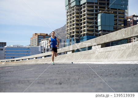 Man is running on bridge, fitness and cardio outdoor for health and training for marathon. Exercise in city, runner with speed and energy, sports and athlete on urban street for race and endurance Man is running on bridge, fitness and cardio outdoor for health and training for marathon. Exercise in city, runner with speed and energy, sports and athlete on urban street for race and endurance 139513939
