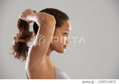Fitness, tie hair or profile of model isolated on grey background for wellness or sports. Woman, ponytail or person with natural hairstyle ready to start exercise, training or workout in studio 139513972