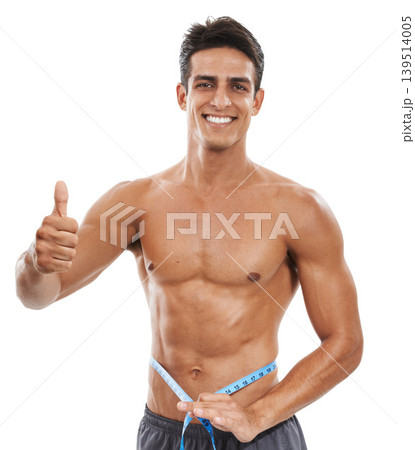 Man is shirtless, measuring tape and thumbs up, check weight progress for health and fitness isolated on white background. Smile in portrait, success or okay with body goal and muscle in studio 139514005