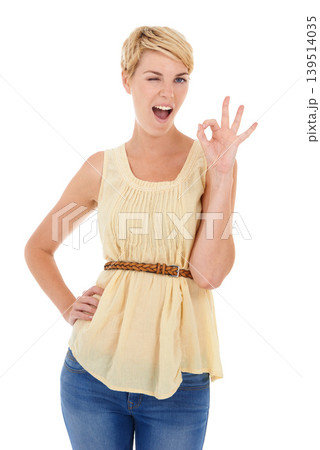 Happy woman, portrait and wink with okay sign for good job or perfect gesture on a white studio background. Female person, model or blonde smile with like emoji, yes or ok for approval or spot on Happy woman, portrait and wink with okay sign for good job or perfect gesture on a white studio background. Female person, model or blonde smile with like emoji, yes or ok for approval or spot on 139514035