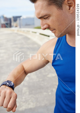 Man, fitness and looking at watch in city for workout, exercise or monitoring outdoor performance. Closeup of male person or athlete checking wristwatch for training or heart rate in an urban town 139514199