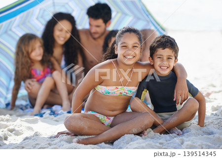 Girl, boy with family on beach and smile in portrait, summer vacation with hug, bonding and love. People outdoor, holiday in Brazil with sand and sun, children happy for travel and adventure together Girl, boy with family on beach and smile in portrait, summer vacation with hug, bonding and love. People outdoor, holiday in Brazil with sand and sun, children happy for travel and adventure together 139514345