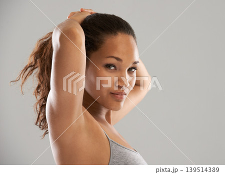 Fitness, tie hair or portrait of model isolated on grey background for wellness or sports. Woman, ponytail or person with natural hairstyle ready to start exercise, training or workout in studio Fitness, tie hair or portrait of model isolated on grey background for wellness or sports. Woman, ponytail or person with natural hairstyle ready to start exercise, training or workout in studio 139514389