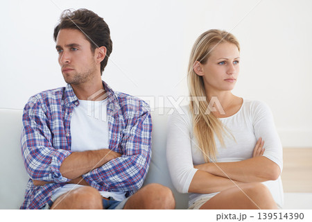 Couple, angry and living room couch with disagreement, upset and thinking with anger, fight or mad. Divorce, betrayal and relationship with cheating, stress and argument for marriage, home or toxic Couple, angry and living room couch with disagreement, upset and thinking with anger, fight or mad. Divorce, betrayal and relationship with cheating, stress and argument for marriage, home or toxic 139514390