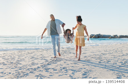 Happy parents, beach and swing child in sunshine for freedom, fun and support together on holiday, vacation and travel to Bali. Family, mom and dad lifting boy kid for jump, play and energy at ocean Happy parents, beach and swing child in sunshine for freedom, fun and support together on holiday, vacation and travel to Bali. Family, mom and dad lifting boy kid for jump, play and energy at ocean 139514408