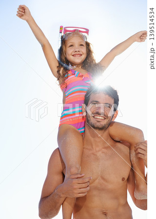 Happy father, girl and piggyback at beach for summer holiday, weekend or vacation together. Dad carrying child, kid or daughter on shoulders in the sun for fun day by the ocean or outdoor nature 139514534