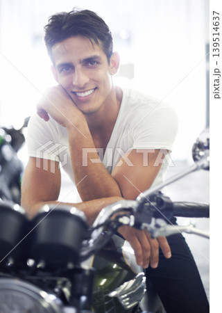 Happy man, portrait and motorcycle in garage for cool transportation or small vehicle at home. Face of young handsome male person or biker smile and leaning on cool automobile or mechanical motorbike 139514637
