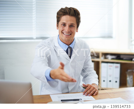 Handshake, happy and man doctor in office for greeting hello at a medical consultation at clinic. Smile, professional and young male healthcare worker with shaking hand gesture in a medicare hospital Handshake, happy and man doctor in office for greeting hello at a medical consultation at clinic. Smile, professional and young male healthcare worker with shaking hand gesture in a medicare hospital 139514733