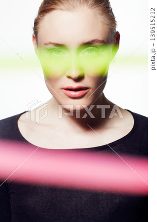 Woman, beauty and light streak with makeup, creativity and glow, skin and headshot isolated on white background. Art deco, neon color and shine with portrait, cosmetic or fashion with model in studio 139515212