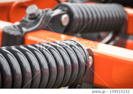 Steel black spring as part of agricultural machine. Technology Steel black spring as part of agricultural machine. Technology 139515232