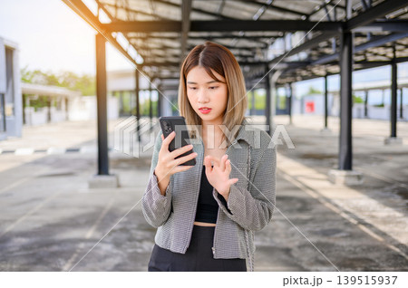 asian businesswoman use smartphone for working or shopping online outdoor  139515937