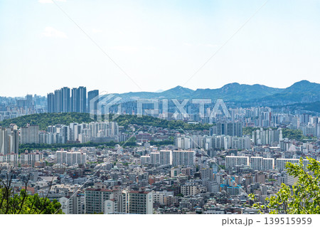 Seoul, South Korea - Mar. 08, 2026 : Panoramic cityscape of Seoul with dense residential buildings and Han River from Yongmasan observatory Seoul, South Korea - Mar. 08, 2026 : Panoramic cityscape of Seoul with dense residential buildings and Han River from Yongmasan observatory 139515959