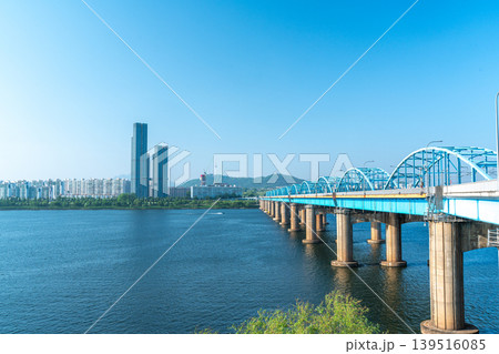 Seoul, South Korea - Mar. 01, 2026 : Scenic View of Dongjak Bridge over Han River with Namsan Seoul Tower under Clear Blue Sky in Spring Seoul, South Korea - Mar. 01, 2026 : Scenic View of Dongjak Bridge over Han River with Namsan Seoul Tower under Clear Blue Sky in Spring 139516085