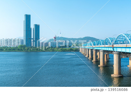 Seoul, South Korea - Mar. 01, 2026 : Scenic View of Dongjak Bridge over Han River with Namsan Seoul Tower under Clear Blue Sky in Spring Seoul, South Korea - Mar. 01, 2026 : Scenic View of Dongjak Bridge over Han River with Namsan Seoul Tower under Clear Blue Sky in Spring 139516086