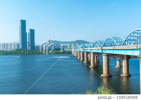 Seoul, South Korea - Mar. 01, 2026 : Scenic View of Dongjak Bridge over Han River with Namsan Seoul Tower under Clear Blue Sky in Spring 139516089