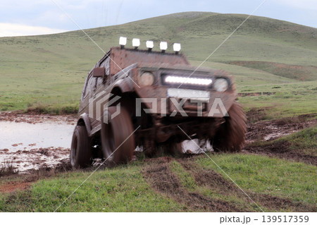 Jeep off road in muddy conditions 139517359