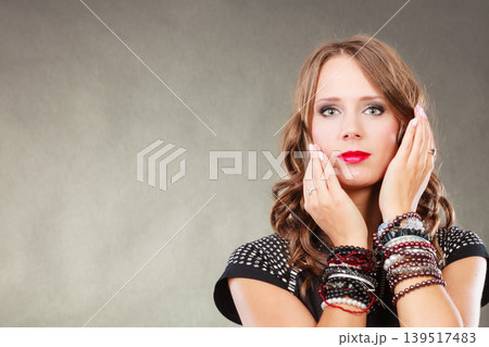 woman with jewellery in black evening dress woman with jewellery in black evening dress 139517483
