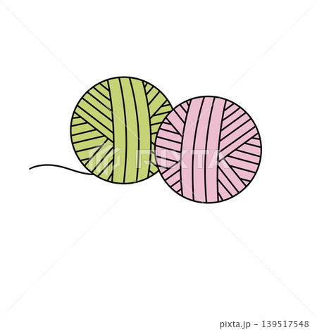 Two yarn balls, green and pink, sit side by side Two yarn balls, green and pink, sit side by side 139517548