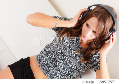 woman in headphones listening music mp3 relaxing woman in headphones listening music mp3 relaxing 139517571