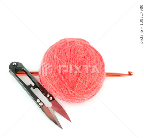 Pink Wool Yarn Ball with Crochet Hook and Thread Snips Isolated on White Pink Wool Yarn Ball with Crochet Hook and Thread Snips Isolated on White 139517980