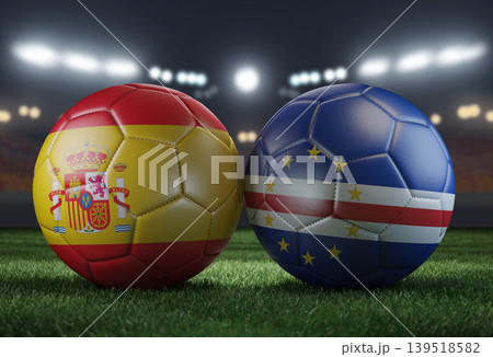 Two soccer balls in flags colors on a stadium blurred background. Spain vs Cabo Verde. 3D image. Two soccer balls in flags colors on a stadium blurred background. Spain vs Cabo Verde. 3D image. 139518582